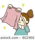 A woman hanging up the laundry 802966