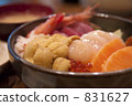 Bowl of rice topped with sashimi  831627