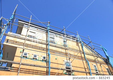 A blue sky and a house under construction A blue sky and a house under construction 883245
