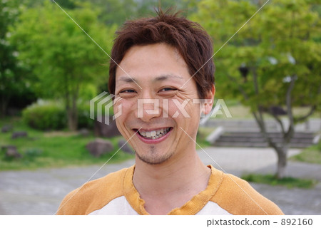 A man laughing at the park A man laughing at the park 892160