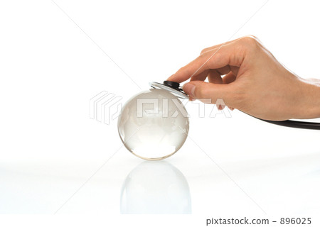Hand with earth and stethoscope 896025