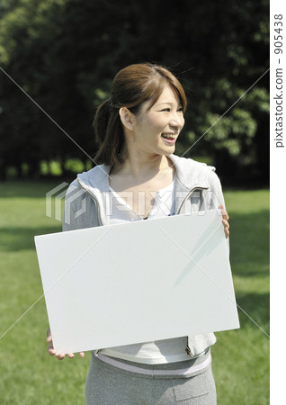 A woman with a white board A woman with a white board 905438
