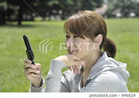 A woman with a cell phone A woman with a cell phone 946829