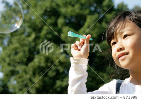 Girl looking happy soap bubble 971999