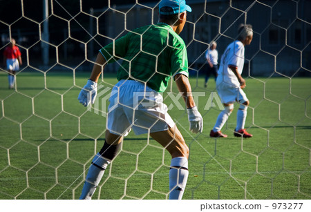 Senior men playing soccer 973277