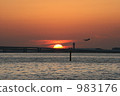 The sea surface against which the sunset hits 983176