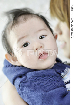 A newborn baby and a young mother in her arms A newborn baby and a young mother in her arms 990889