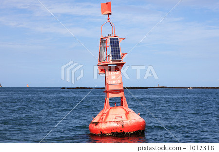 A red buoy floating in the northern part of France 1012318