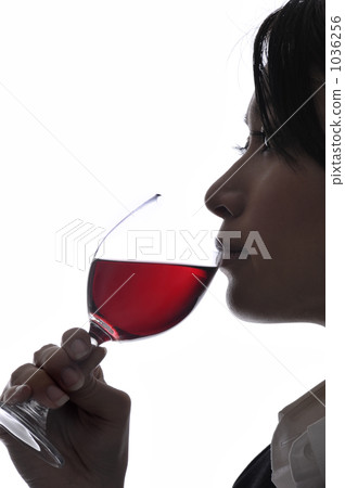 A woman drinking wine 1036256