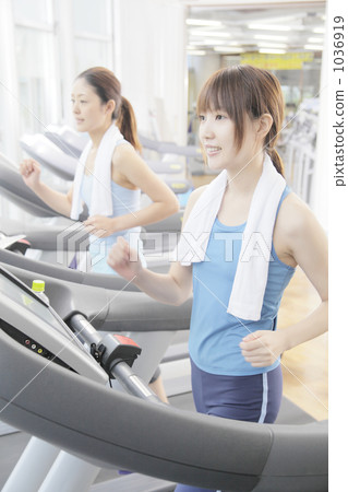 Young female, fitness machine, training 1036919