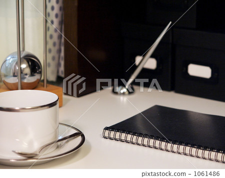 Writing utensils and coffee cups placed on the desk Writing utensils and coffee cups placed on the desk 1061486