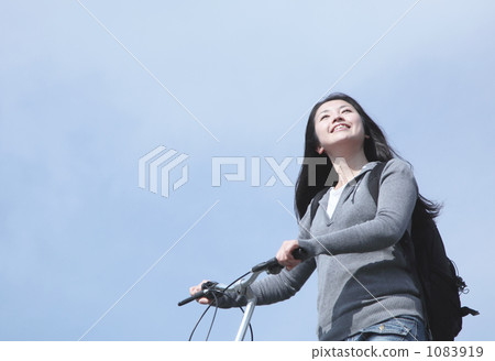 Woman riding a bicycle Woman riding a bicycle 1083919