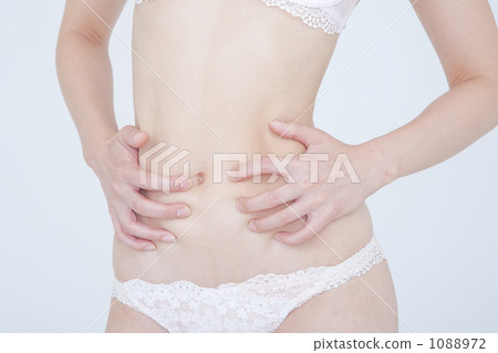 Women in underwear worrying about waist 1088972
