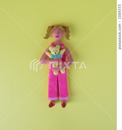 A woman with a bear's stuffed animal A woman with a bear's stuffed animal 1089355