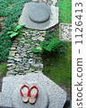 Sandals with red thongs and cobblestones 1126413