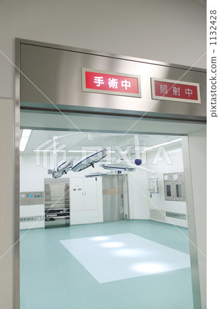 The entrance to an empty operating room with the in-operation indicator light on 1132428