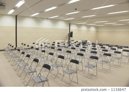 A view of the conference room at a business seminar venue and the interior of an empty venue with microphones and sound equipment lined up A view of the conference room at a business seminar venue and the interior of an empty venue with microphones and sound equipment lined up 1138647