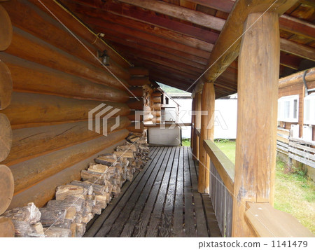 On the corridor of the log house 1141479