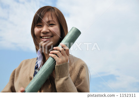 School girls with a diploma and blue sky School girls with a diploma and blue sky 1152311