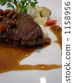 Beef fillet meat poured with seasonal vegetables Beef fillet meat poured with seasonal vegetables 1158956