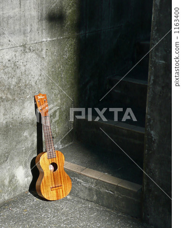 Ukulele under the concrete stairs Ukulele under the concrete stairs 1163400