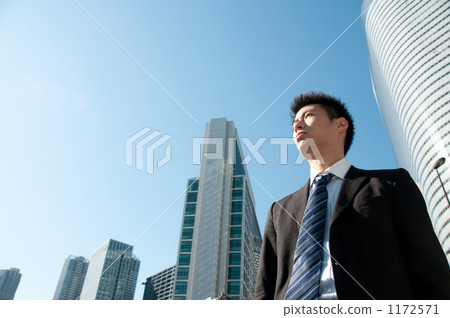 Businessman and skyscraper Businessman and skyscraper 1172571