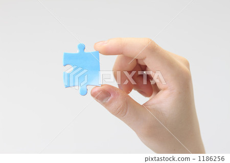 Jigsaw puzzle and hand Jigsaw puzzle and hand 1186256