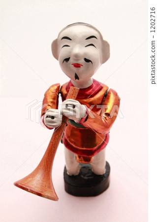 a folk costume, doll, trumpet 1202716
