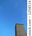 High-rise apartment building in the blue sky High-rise apartment building in the blue sky 1208514