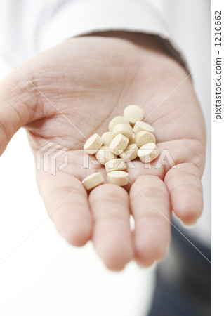 Hand holding medicine Hand holding medicine 1210662