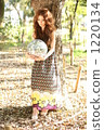 A woman nestling in the forest 1220134