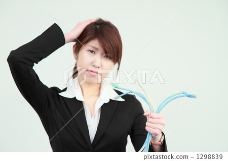 商業女性困擾著電纜 1298839
