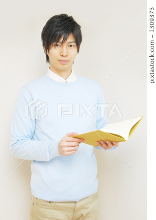 A man reading a book 1309373