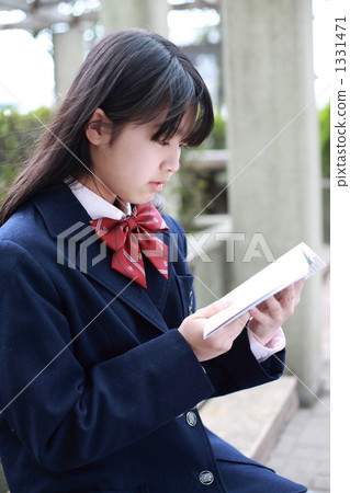 A girl reading a book A girl reading a book 1331471