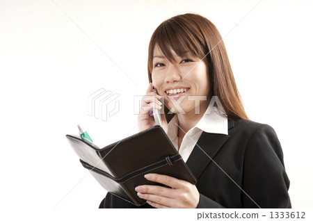 Career woman with a cell phone 1333612