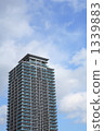 High-rise apartment with blue sky background 1339883