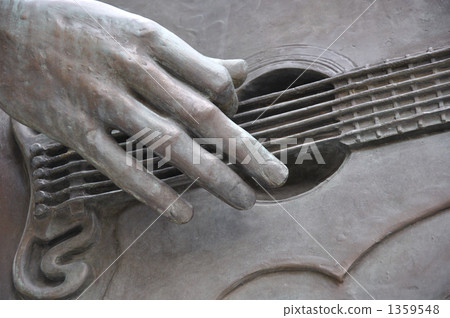 Bronze statue guitar hand 1359548