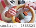 Baby's hand with toys 1363323