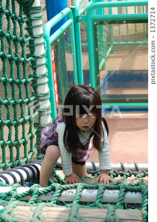 A girl playing with plaything 1372714