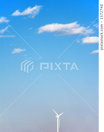 A windmill turning with a fresh wind 1372748