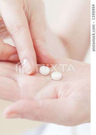 Up of hand holding medicine Up of hand holding medicine 1399994