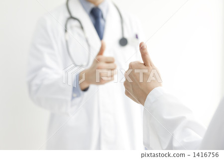 Male and female doctor standing thumb Male and female doctor standing thumb 1416756