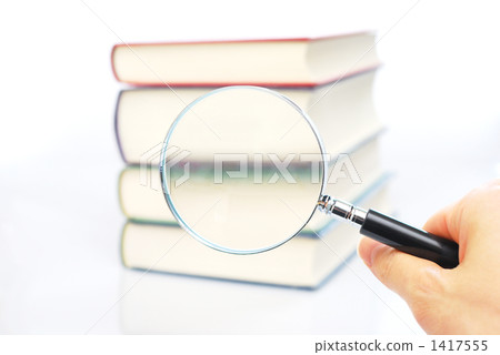 Magnifying glasses and books 1417555