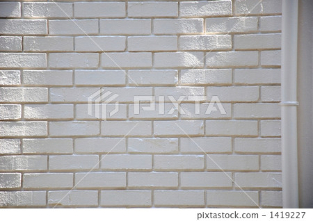 White brick wall and drain pipe 1419227