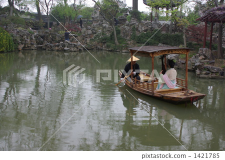 A woman who plays biwa on the lake in the Chinese garden 1421785