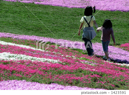 Sister walking along the path with moss slope Sister walking along the path with moss slope 1423591