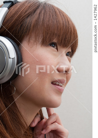 Young women in headphones 1427962
