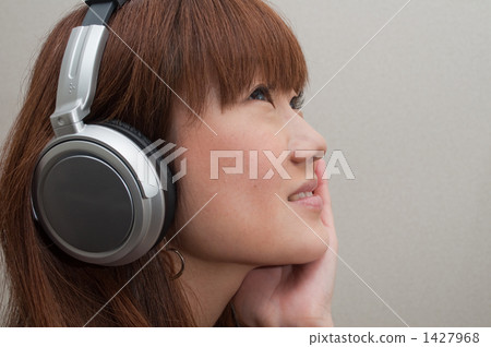 Young women in headphones 1427968