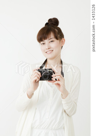 A young lady with a camera A young lady with a camera 1433126