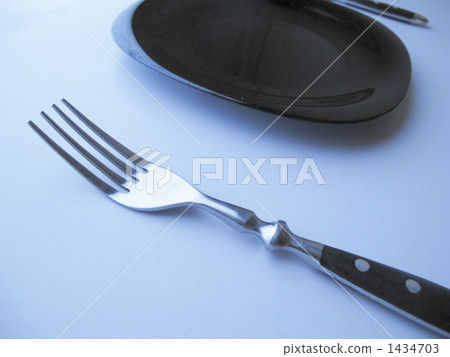 Fork and black dish Fork and black dish 1434703